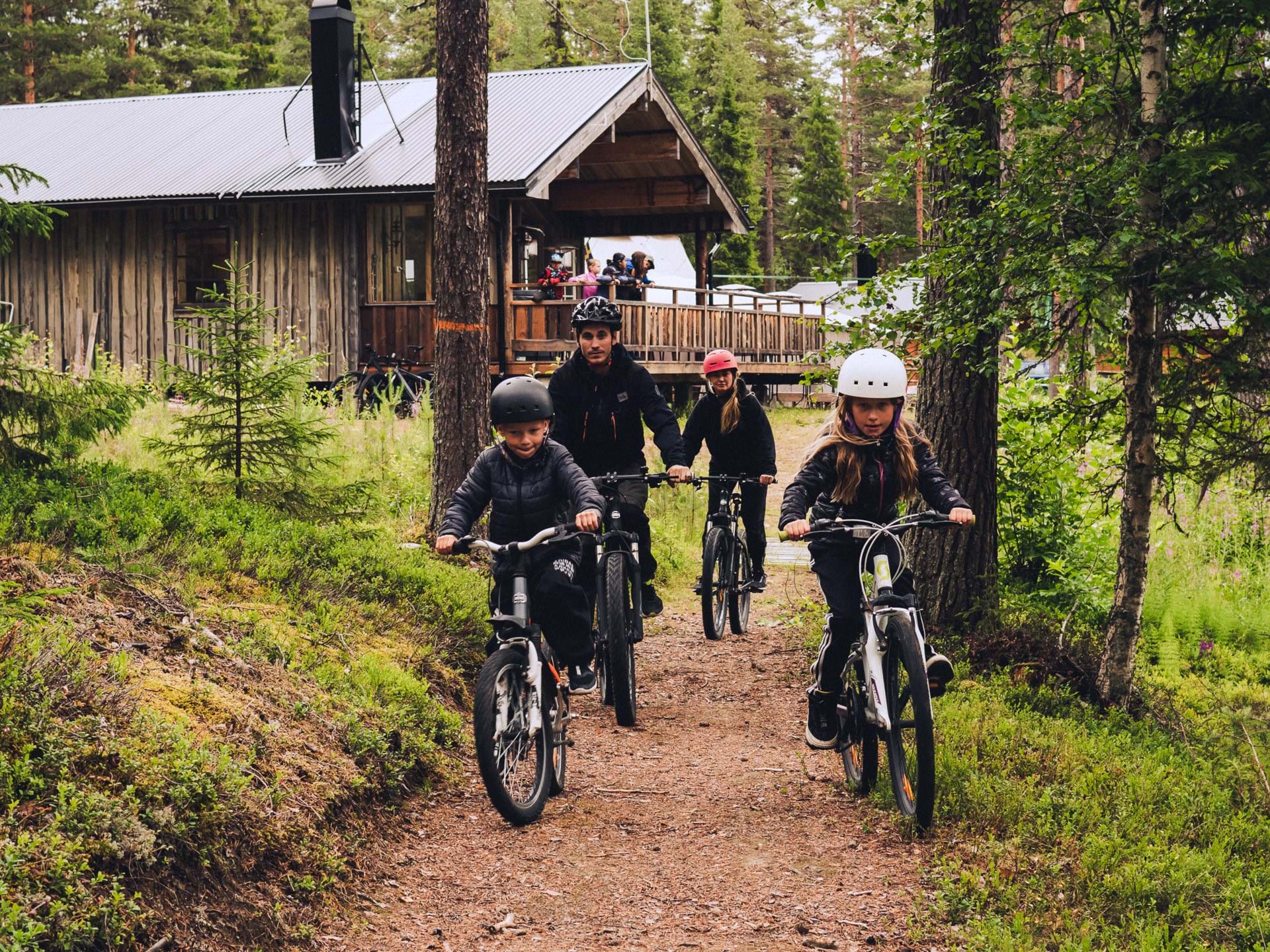 Charlotta and her family cycle along one of the paths in the forest.