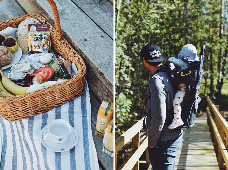 A coffee cup next to a wicker basket that contains essentials needed for a good breakfast.