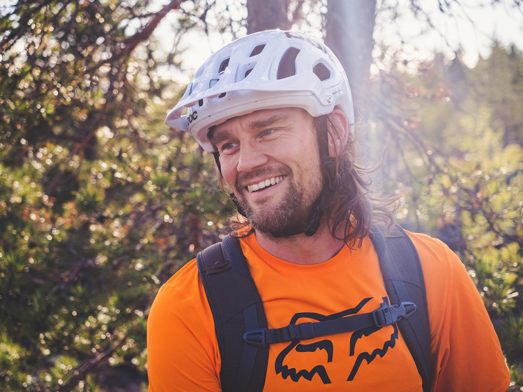 Close up of a happy Robert with bicycle helmet on his head.