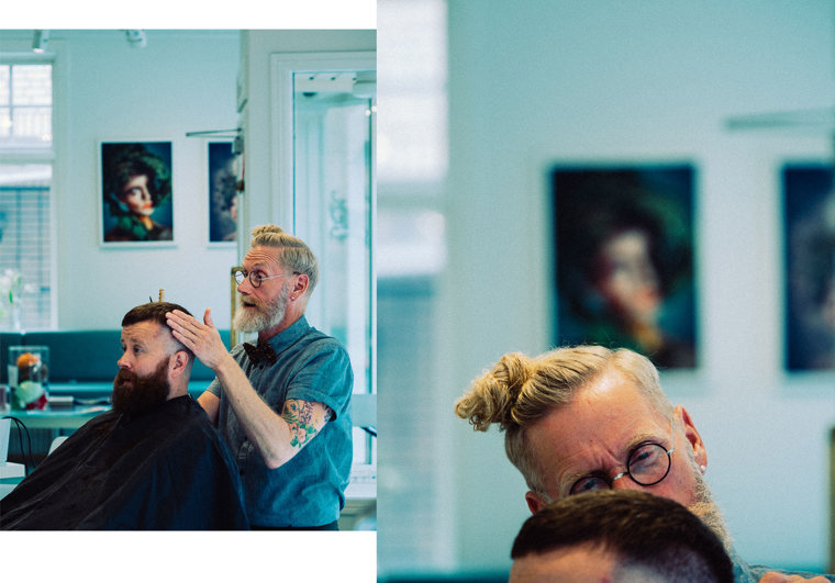 Fredrik gives a customer a haircut at the salon.